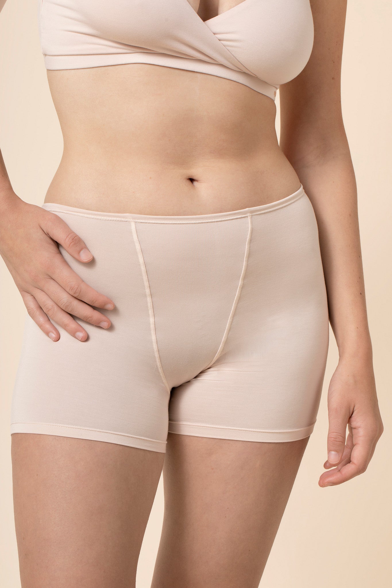 Close up of the Women's Boxer in Blonde on a model standing in front of a beige background 