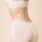 Model show casing the back side of the Women's Boxer in Blonde and of the matching bra
