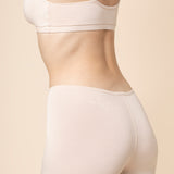 Model show casing the back side of the Women's Boxer in Blonde and of the matching bra
