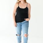 Model in Kyte Baby's Women’s Camisole in Midnight and jeans