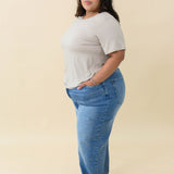 Female wearing the Women's Crew Neck Tee in Almond paired with Jeans