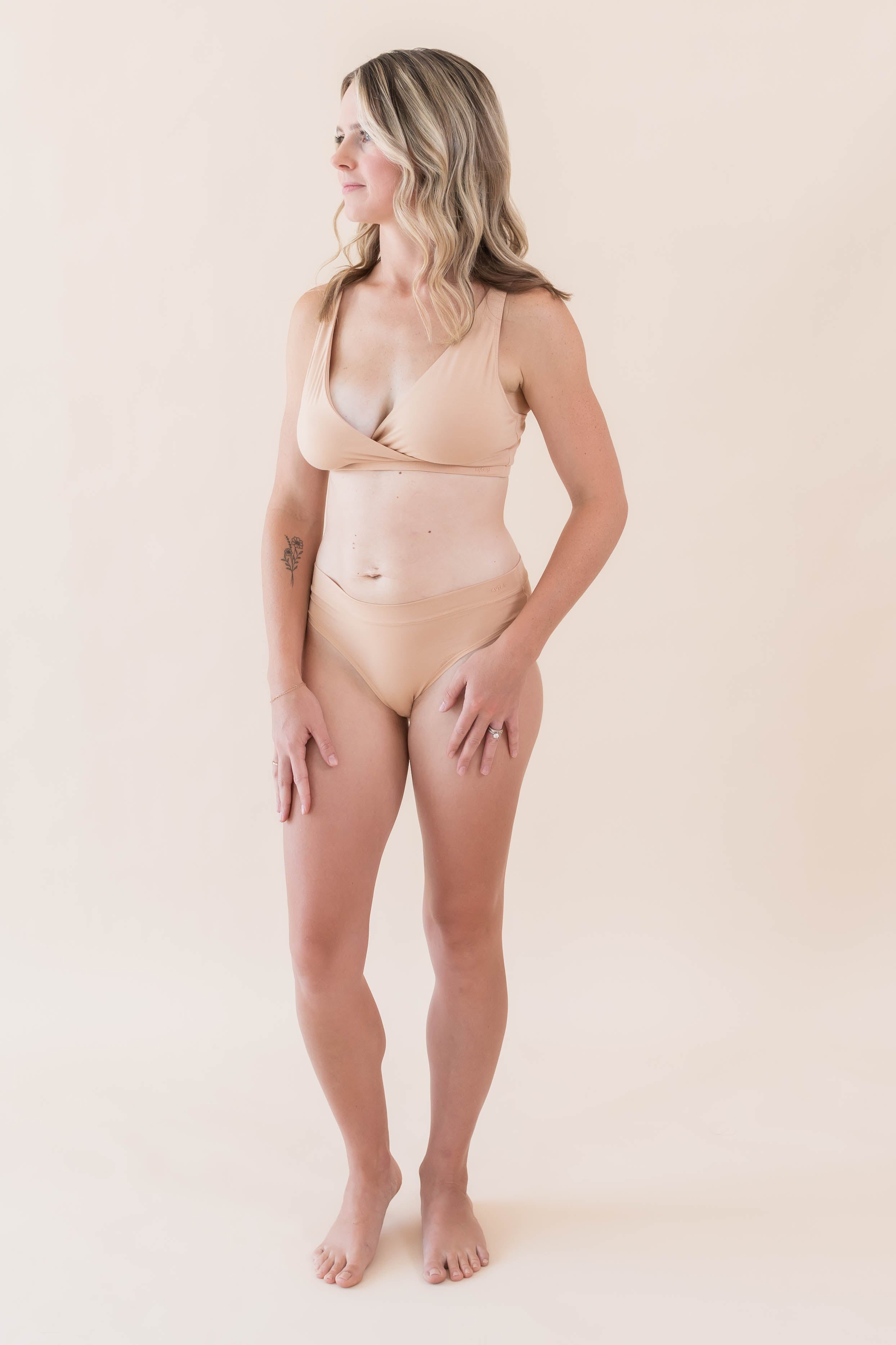 Model wearing Kyte Baby's Women's Cross Front Bralette in Chai