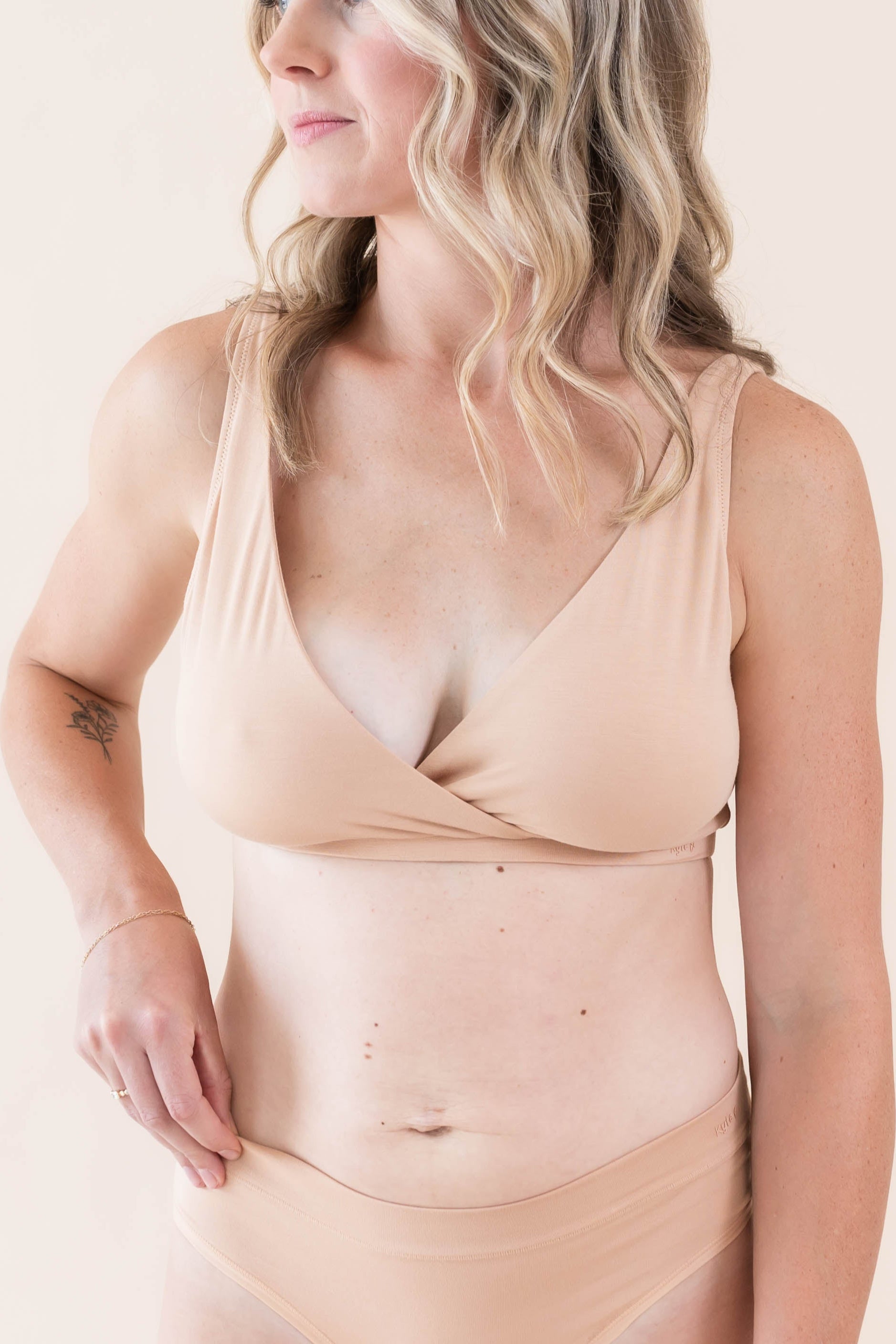 Close up of model wearing Women's Cross Front Bralette in Chai and Women's Midi Brief in Chai 