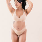 Model wearing Kyte Baby's Women's Cross Front Bralette in Chai