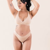 Model wearing Kyte Baby's Women's Cross Front Bralette in Chai