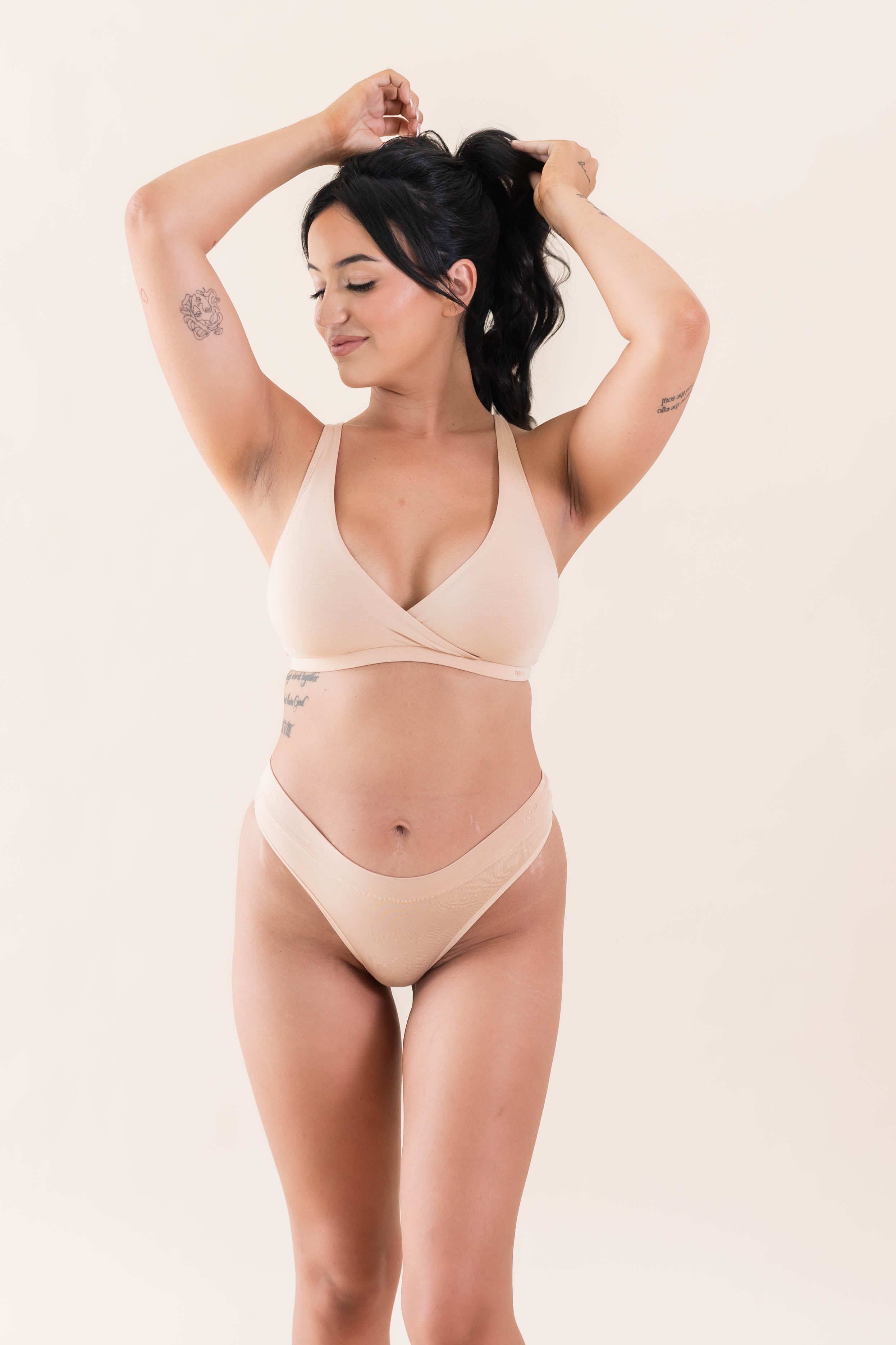 Model wearing Kyte Baby's Women's Cross Front Bralette in Chai