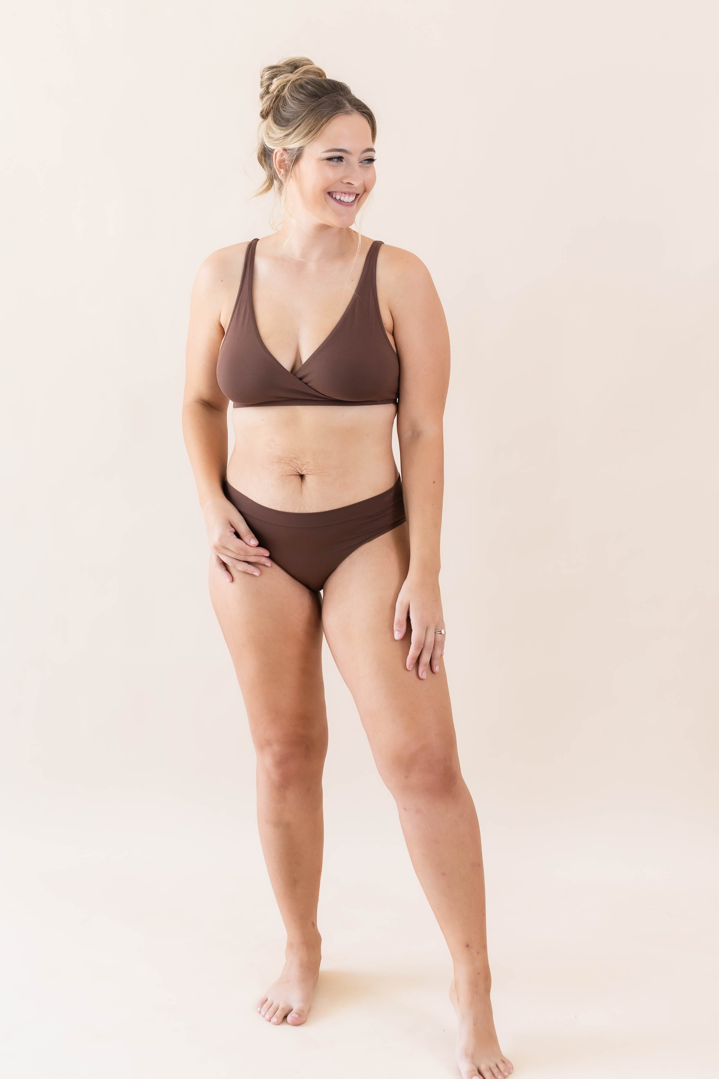 Model wearing Kyte Baby's Women's Cross Front Bralette in Toffee