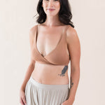 Woman wearing Kyte Baby's Women's Cross Front Bralette in Latte