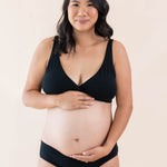 Model wearing Kyte Baby's Women's Cross Front Bralette in Midnight