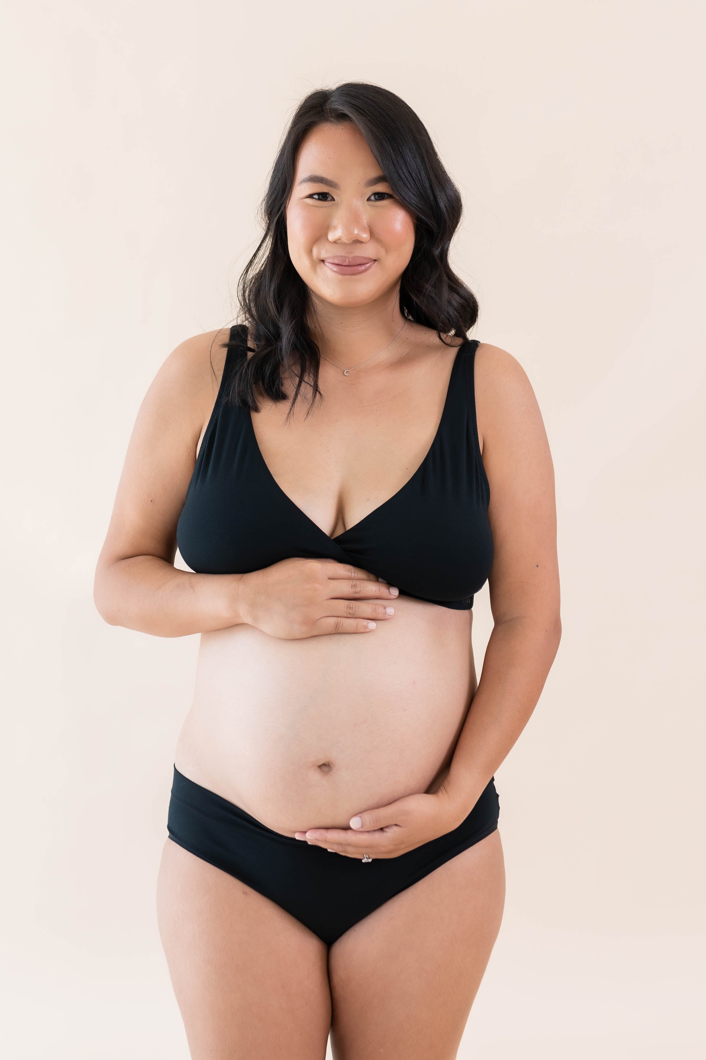 Model wearing Kyte Baby's Women's Cross Front Bralette in Midnight