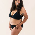 Model wearing Kyte Baby's Women's Cross Front Bralette in Midnight