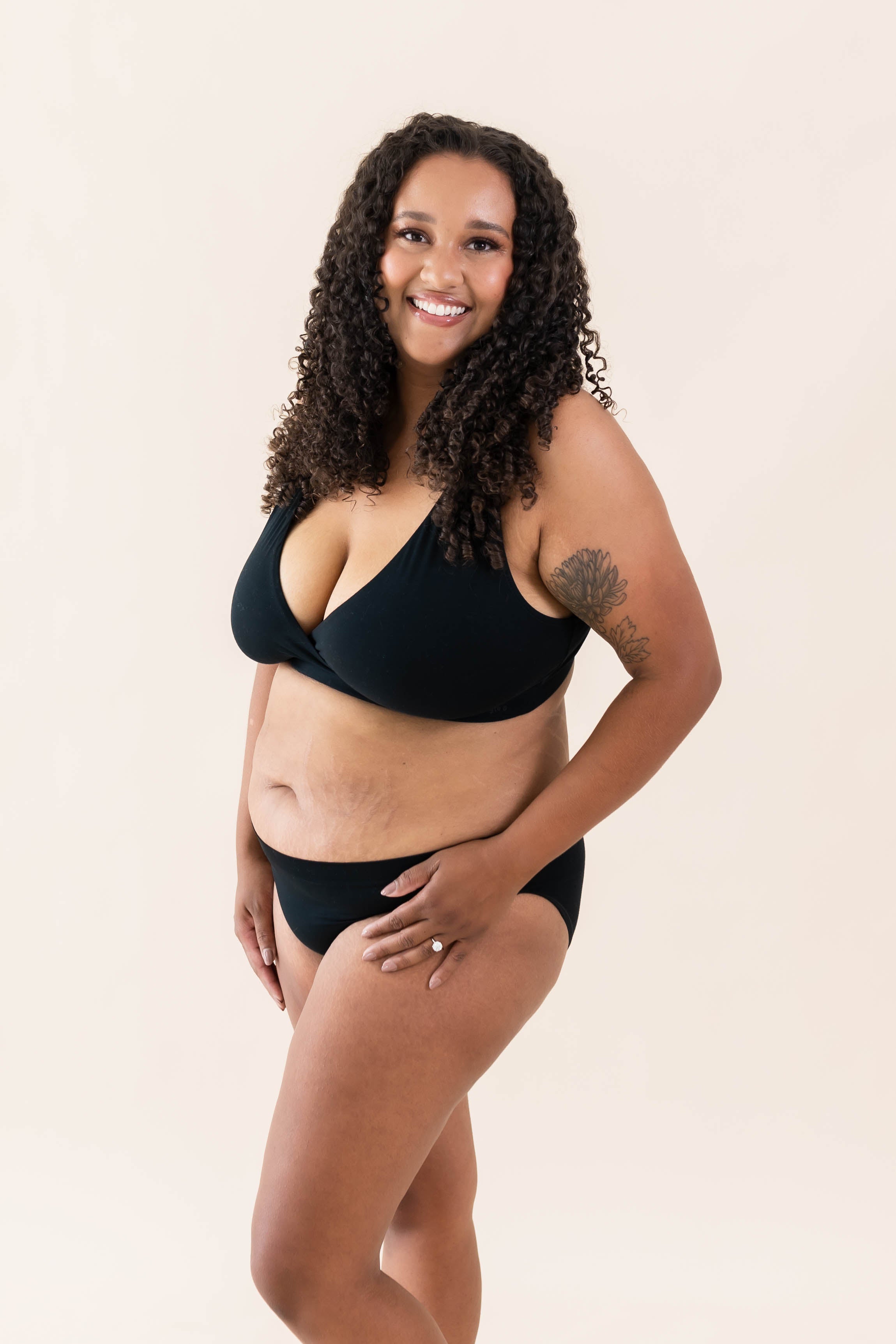Model wearing Kyte Baby's Women's Cross Front Bralette in Midnight
