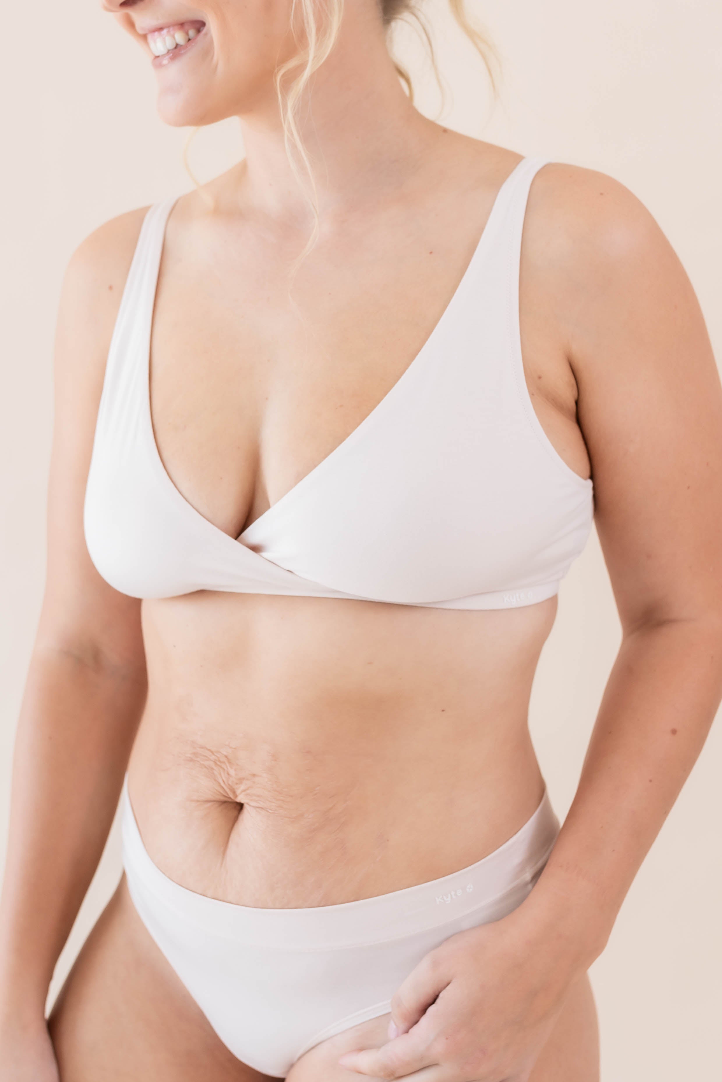 Close up of the front of the Women's Cross Front Bralette in Blonde on a model