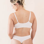 Woman modeling the back of the Women's Cross Front Bralette in Blonde 