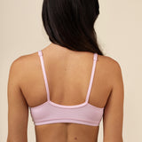 Back side of the Women's Cross Front Bralette in Peony on a model 