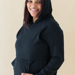 Model wearing the Women's French Terry Nursing Hoodie in Midnight with the hood up