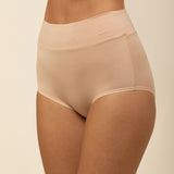 Beige high-waisted underwear on a beige background