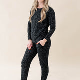 Model wearing Kyte Baby's Women's Jogger Pajama Set in Midnight Leopard