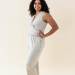 Model wearing the Women's Jumpsuit in Almond with one hand on hip