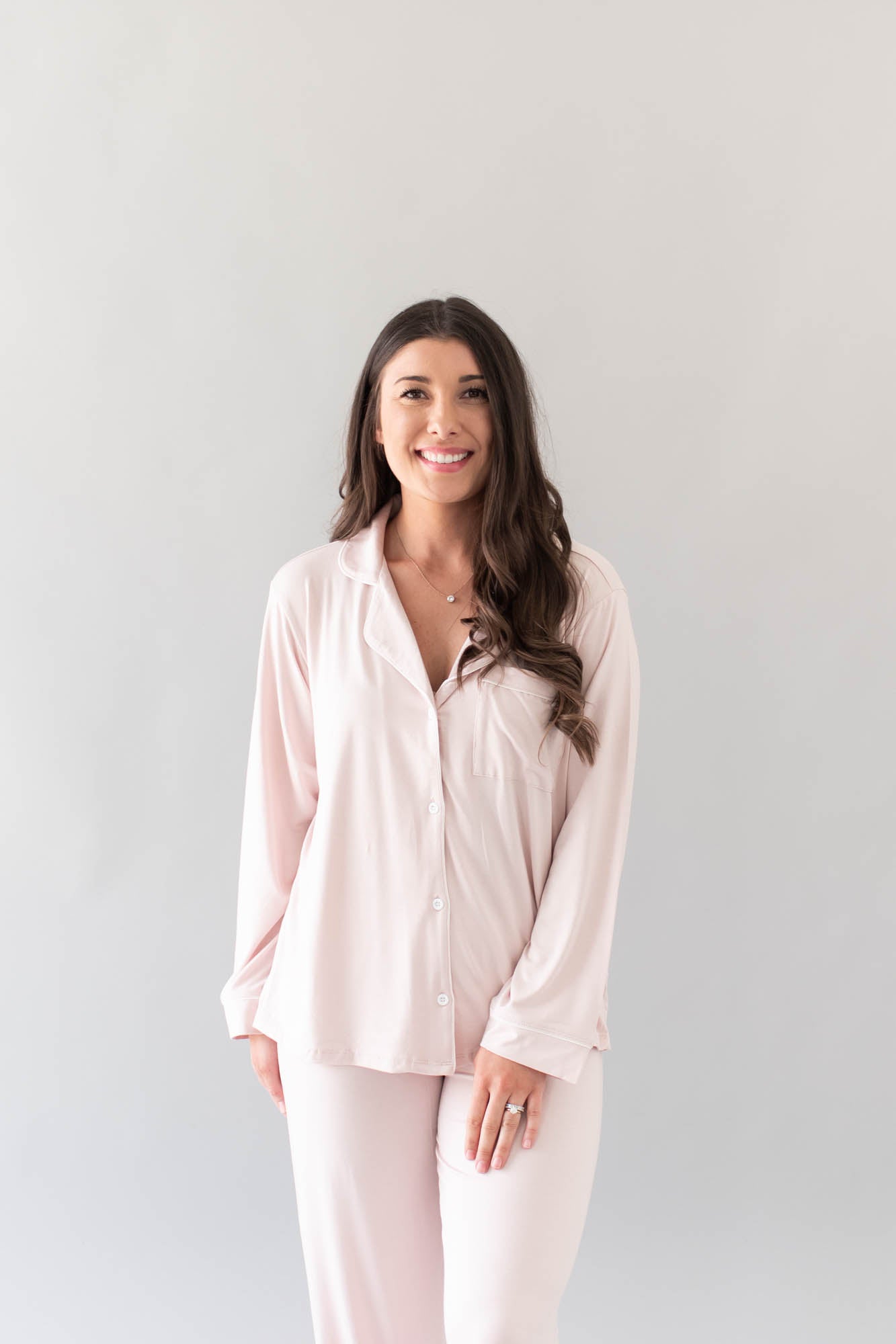 Closer photo of model wearing the Women's Long Sleeve Pajama Set in Blush with Cloud Trim
