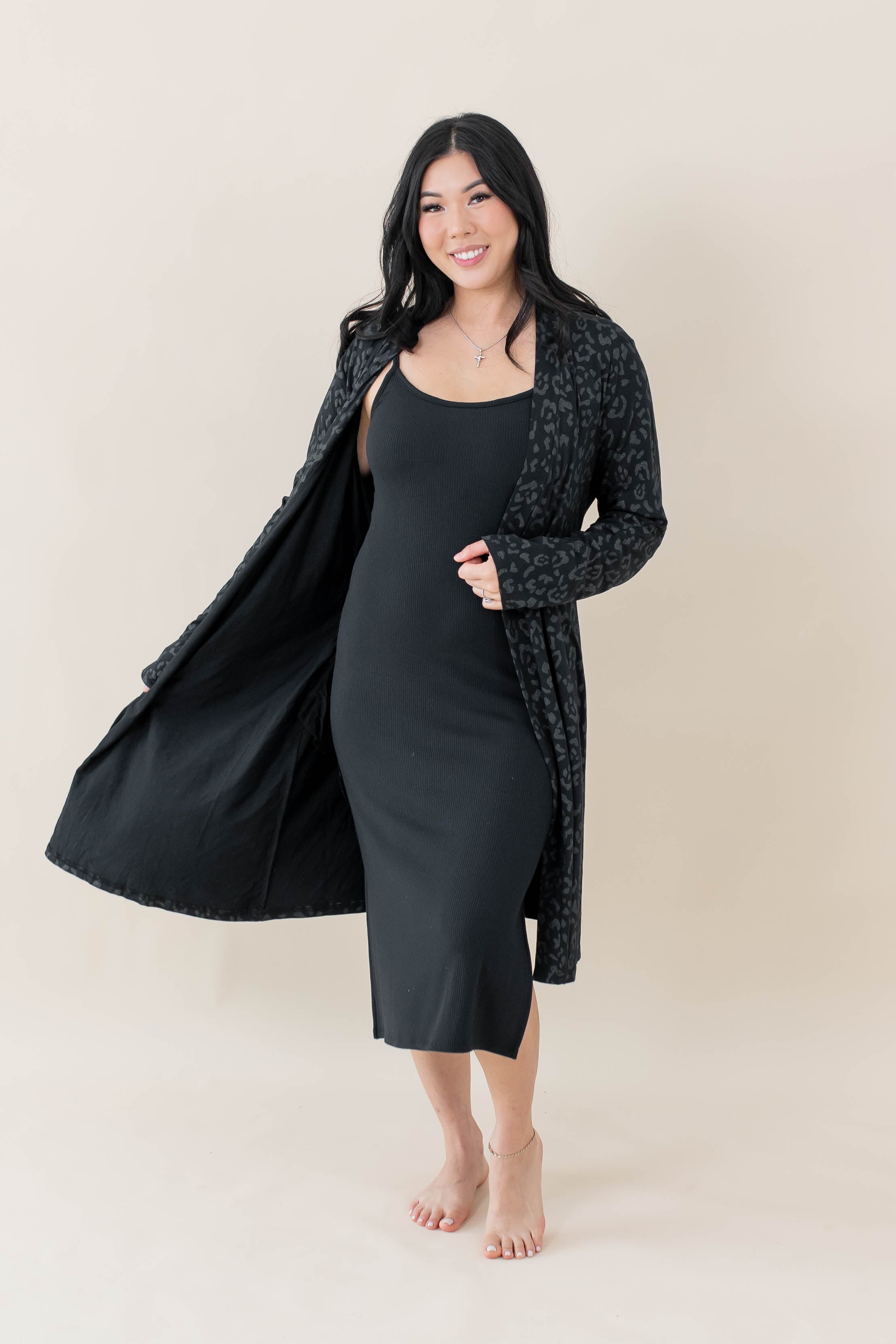 Model wearing the Women's Lounge Robe in Midnight Leopard overtop the Women's Ribbed Cami Dress in Midnight