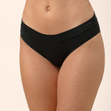 Black bamboo underwear worn by a person on a beige background