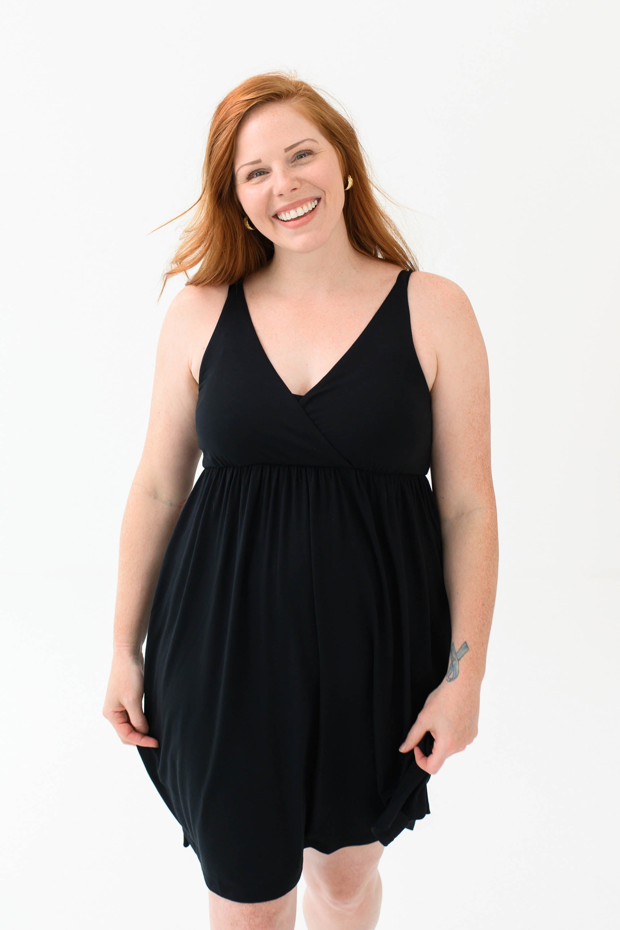 Woman modeling Kyte Baby's Women's Nightgown in Midnight