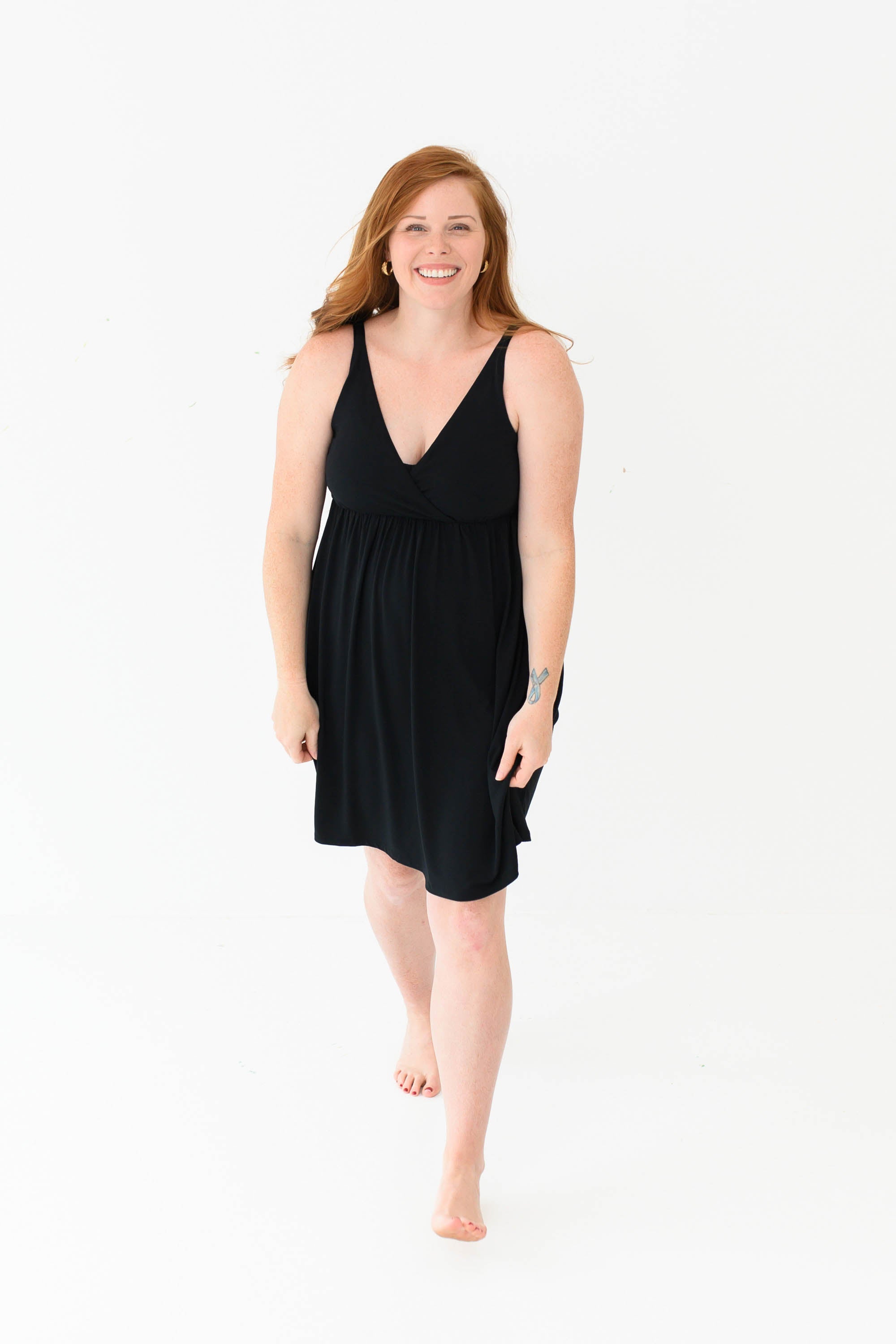 Woman modeling Kyte Baby's Women's Nightgown in Midnight