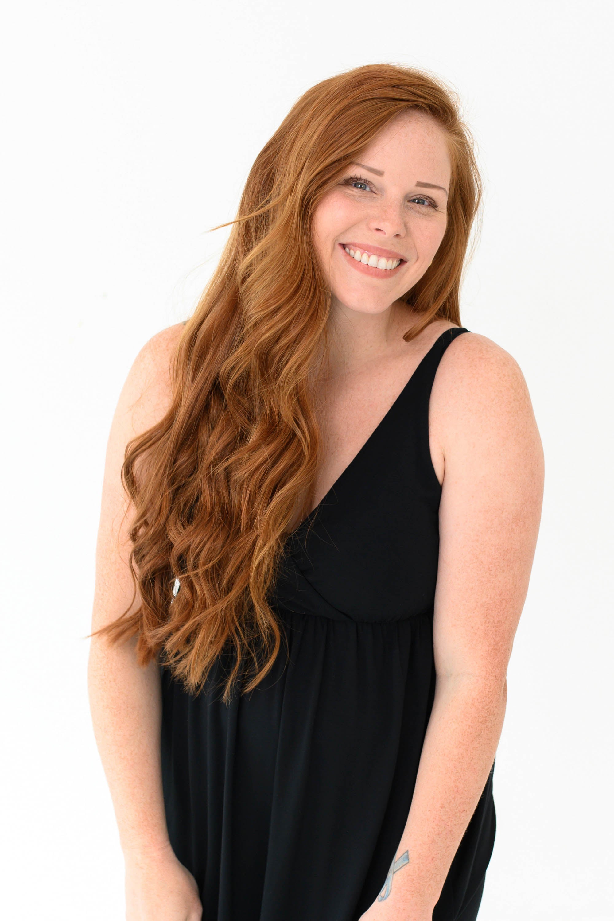 Woman modeling Kyte Baby's Women's Nightgown in Midnight