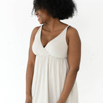 Woman modeling Kyte Baby's Women's Nightgown in Oat