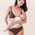 Model nursing her baby in the Women's Nursing Bra in Toffee