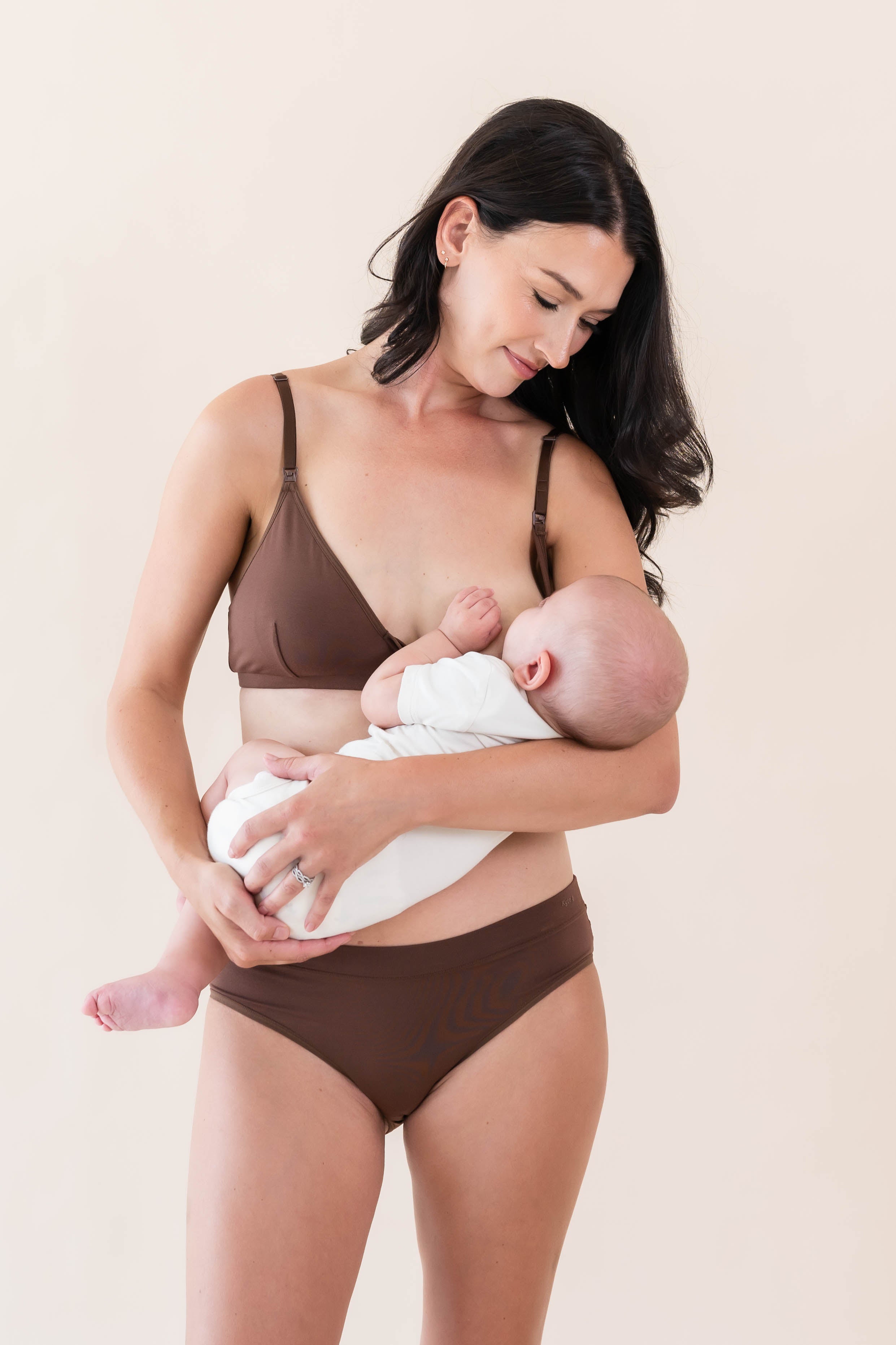 Model nursing her baby in the Women's Nursing Bra in Toffee