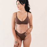 Model wearing Kyte Baby's Women's Nursing Bra in Toffee with matching Toffee thong