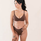 Model wearing Kyte Baby's Women's Nursing Bra in Toffee with matching Toffee thong