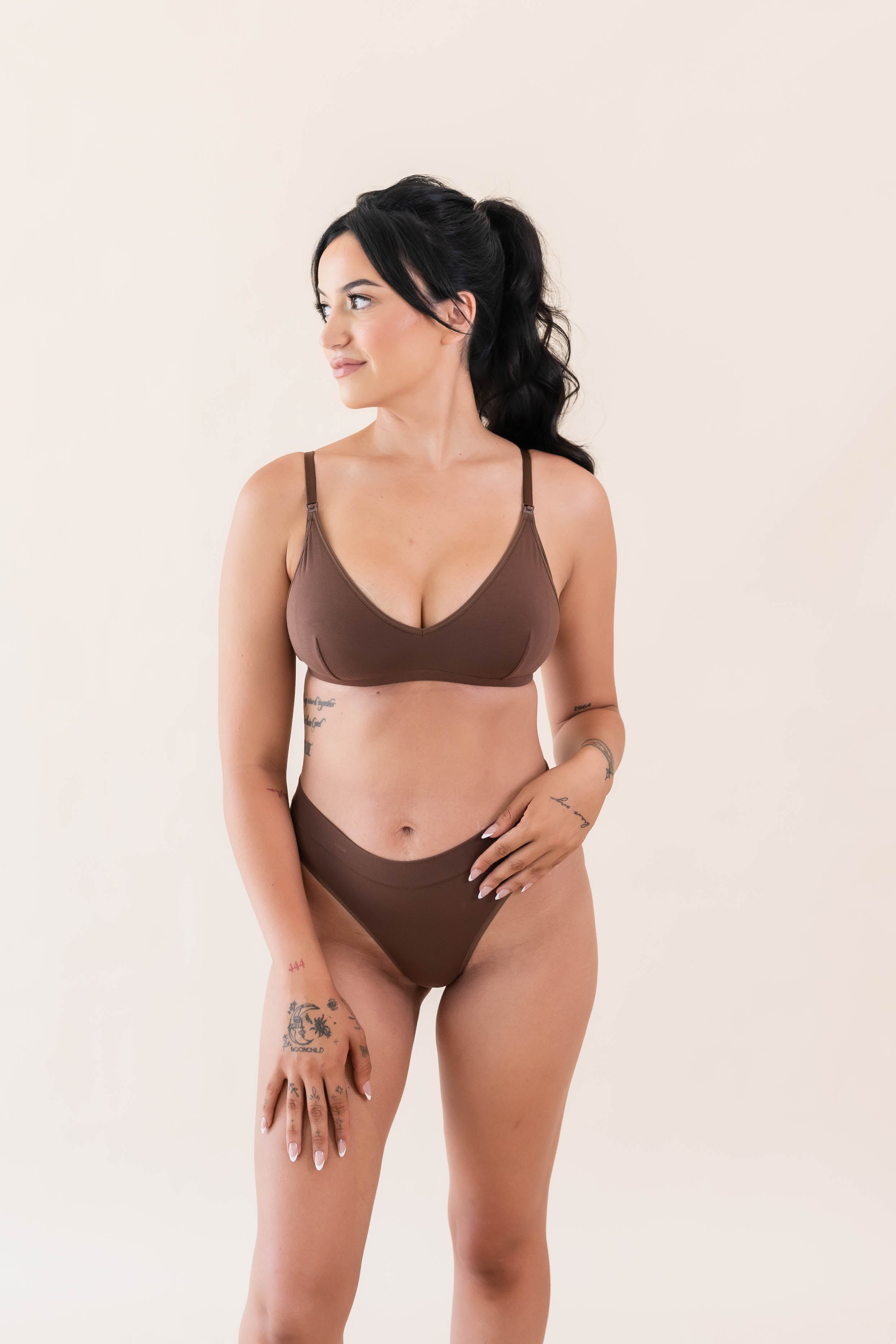 Model wearing Kyte Baby's Women's Nursing Bra in Toffee with matching Toffee thong