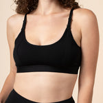 Model wearing the Women's Pumping Bra in Midnight paired with matching underwear 
::: Model is 34D wearing size M ///
