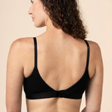 Model show casing the back side and straps of the Women's Pumping Bra in Midnight 