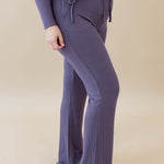 Female model wearing the Women's Ribbed High Waisted Wide Leg Pant in Currant