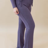 Female model wearing the Women's Ribbed High Waisted Wide Leg Pant in Currant