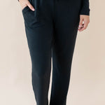 Female wearing the Women's Ribbed High Waisted Wide Leg Pant in Midnight with one hand in pants pocket