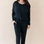 Model wearing the Women's Ribbed High Waisted Wide Leg Pant in Midnight with one hand in pants pocket