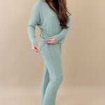 Female model in the Women's Ribbed High Waisted Wide Leg Pant in Thyme paired with a Thyme Drop Shoulder Top