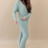 Female model in the Women's Ribbed High Waisted Wide Leg Pant in Thyme paired with a Thyme Drop Shoulder Top