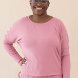 Model wearing the Women's Ribbed Long Sleeve Drop Shoulder Top in Apple Blossom paired with Apple Blossom pants