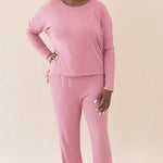 Model wearing the Women's Ribbed Long Sleeve Drop Shoulder Top in Apple Blossom paired with the Apple Blossom High Waisted Wide Leg Pant