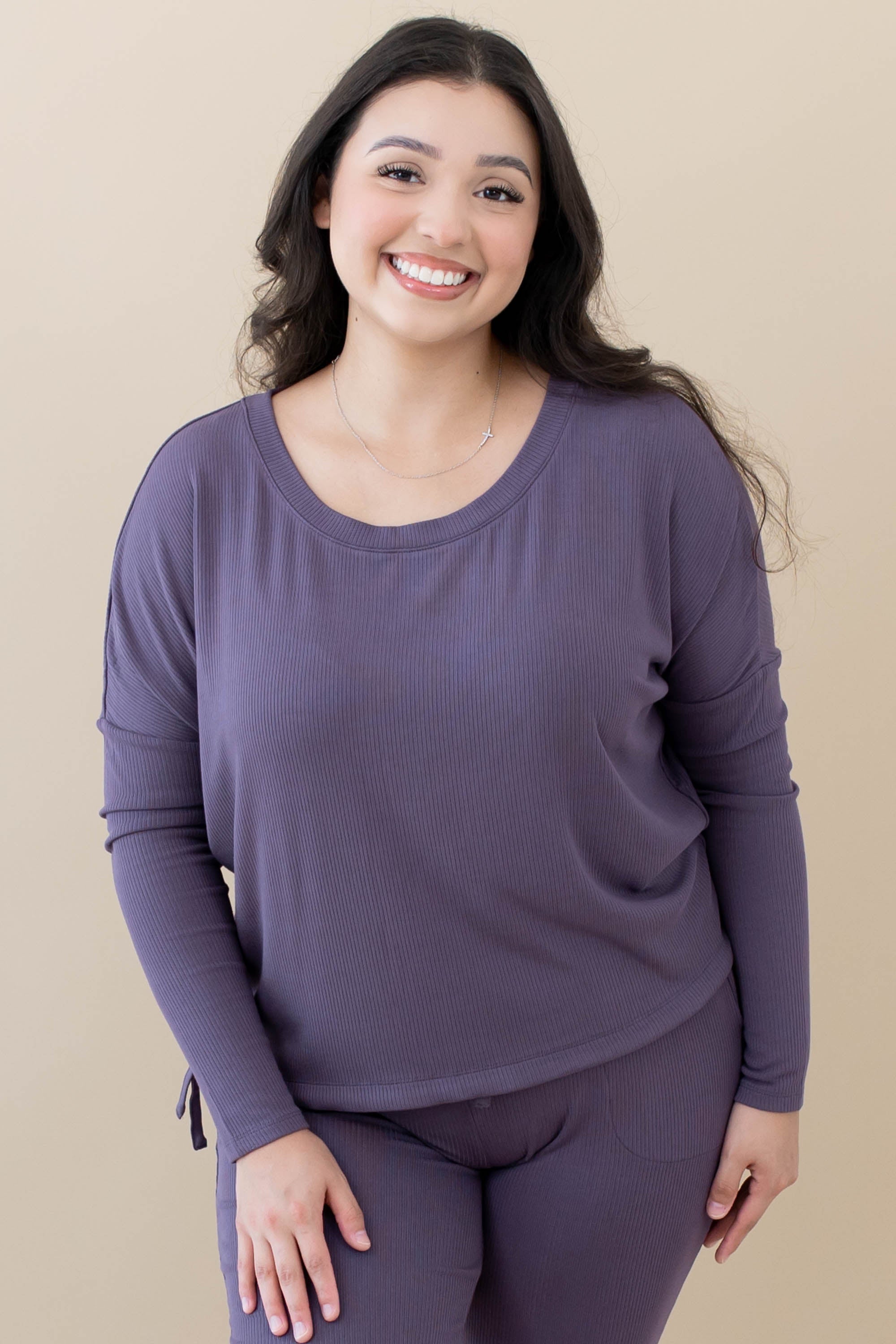 Model wearing the Women's Ribbed Long Sleeve Drop Shoulder Top in Currant paired with Currant pants