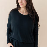 Model wearing the Women's Ribbed Long Sleeve Drop Shoulder Top in Midnight paired with Midnight Pants