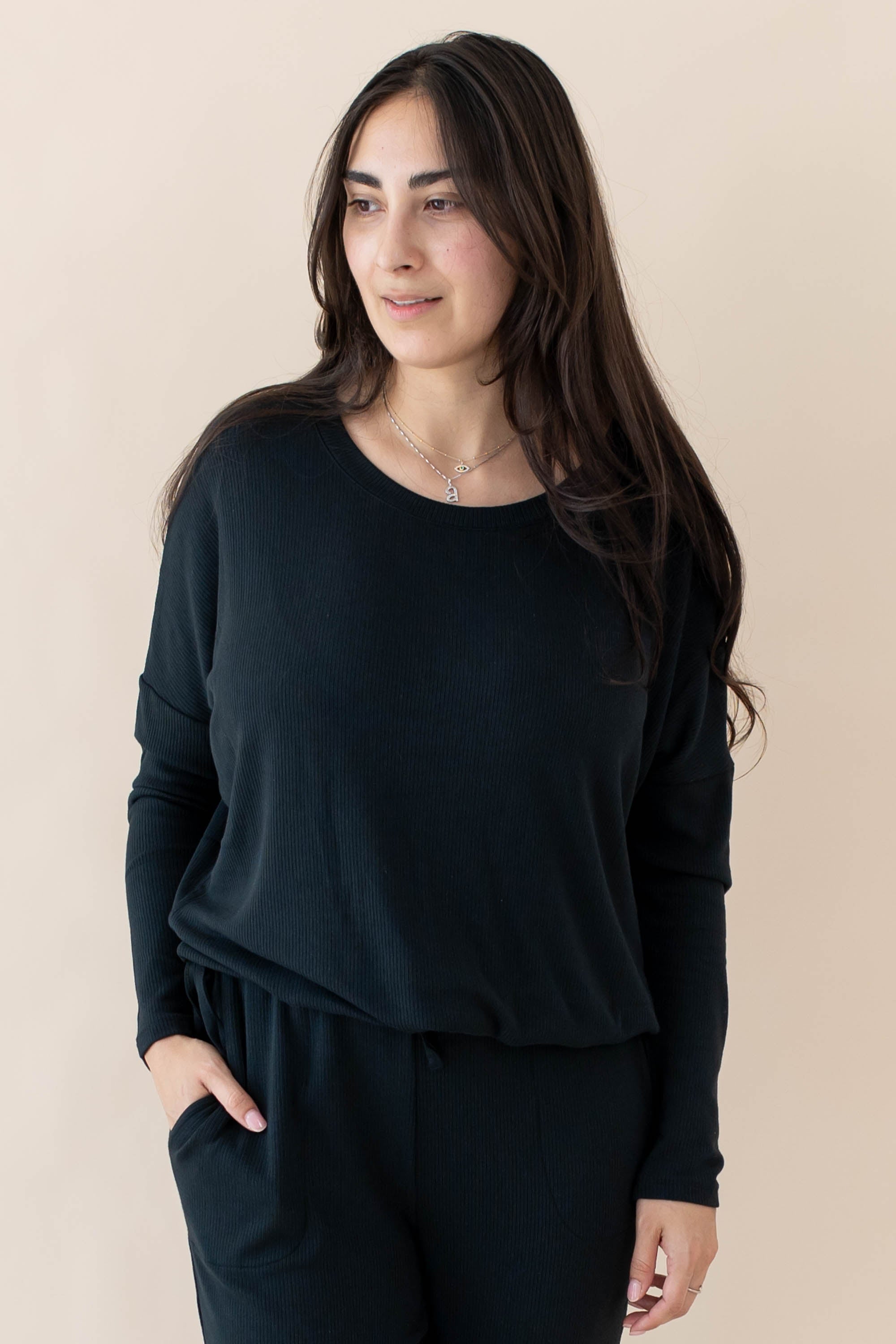 Model wearing the Women's Ribbed Long Sleeve Drop Shoulder Top in Midnight paired with Midnight Pants