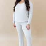 Model wearing the Women's Ribbed Long Sleeve Drop Shoulder Top in Oat paired with Oat Ribbed Wide Leg Pant