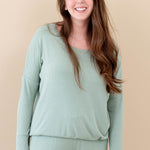 Model wearing the Women's Ribbed Long Sleeve Drop Shoulder Top in Thyme and Thyme Wide Leg Pants